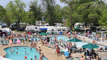 Wide pool and surrounding RV parking/campsite area from an elevated angle — provides an overview of pool and adjacent RV/campsite density; used in the site's gallery/hero images.