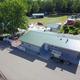 Aerial view of the main service building/amenities area adjacent to the pool — good for showing on-site facilities; sourced from the amenities page.
