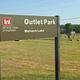 Entrance sign to Outlet Park