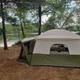 Tent campsite set among trees with immediate lake access visible — useful depiction of tent camping sites and wooded shoreline on the property (site gallery/background).