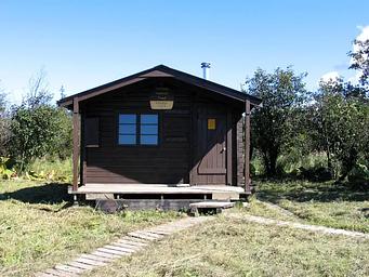 Koknuk Cabin with wood trail in front