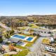 Community pools, playground, and RV park by pond