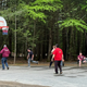 Outdoor recreation area showing a basketball court and surrounding woods; from the site's 'Recreation Areas / sports' image — useful to show activity spaces on the property.