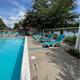 Swimming pool area with lounge chairs — depicts on-site amenities and guest recreation areas (from amenities page).