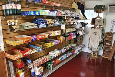 Interior shot of the park’s small RV supply store showing snacks, supplies and apparel; supports guest facilities information from the amenities page.