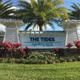 Photograph of the resort entrance sign and landscaping identifying the property and entry experience — suitable for property gallery (gallery page).