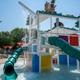 On-site kids’ splash structure/water-play area with slides and water features — clear photo of the park’s aquatic play facility (from homepage gallery).
