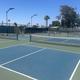 Image of multiple outdoor courts (tennis/pickleball area), illustrating on-site recreational facilities shown on the property’s activity gallery.