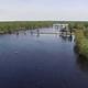 Aerial/drone view of the lake and shoreline with campsites and docks visible — good overall property overview (from the site homepage banner).