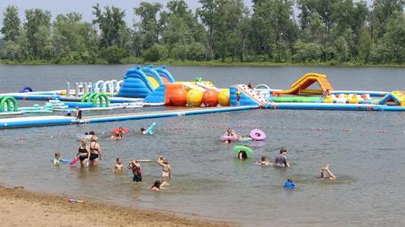 Inflatable aqua park and water park on the lake