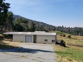 Exterior view of the metal workshop and attached caretaker's apartment. 