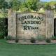 Stone entrance sign reading 'Colorado Landing RV Park'—clear property identifier shown on the park's homepage banner, useful as the primary location image.