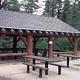This is a picture of a pavilion with picnic tables