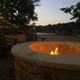 Evening firepit by the lake with seating and lights — shows common outdoor amenity and matches the site's firepit/lake imagery.