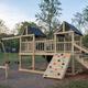 Playground structure on grassy area within the campground — demonstrates family amenities and is shown on the property website.