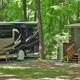 Shady RV Site near a Cabin