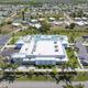 Aerial view of Bonita Terra's clubhouse, pool deck, and surrounding community
