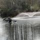 Kayakers on a small lake with a fountain — depicts recreational lake activities on-site and is included among the property’s gallery images.