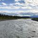 View down the Kennicott River from the footbridge — useful facility/grounds photo (page context caption: ‘From the footbridge’).