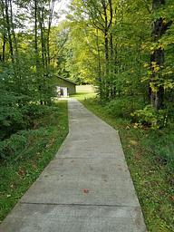 View of the accessible path down to the Clark Lake pavilion from the parking area.