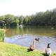 Lakeshore view with ducks and fountain in the distance — another clear view of the campground's lake amenity (from Photo Gallery).