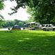 Popup Camper and Tent along river campsite