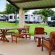 Covered pavilion with picnic tables and RV sites visible beyond — from the Park Events page, showing on-site amenity and nearby RV parking useful for facility/campsite gallery.