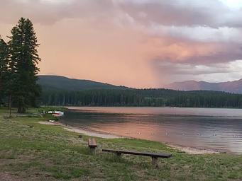 View from Seeley Lake swim beach at dusk. A storm rolls in from the East. 