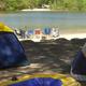 Tents on the lakeside beach showing camping area and shoreline — displayed on the site under 'Beautiful Campsites' and highlights tent camping by the water.