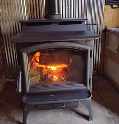 Wood stove with fire burning inside