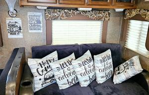 Large RV with outdoor kitchen, fireplace, and TVs