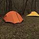 An orange and a yellow tent  pitched at Round Spring