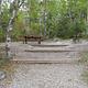 Campsite with picnic table.