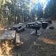 A view of the picnic tables, bear boxes, and other facilities.