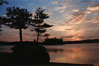 Community event / cookout with campers and RVs visible — shows on-site social events and the campground's family atmosphere.