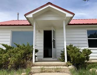 The front porch of Orange Olsen Dwelling.