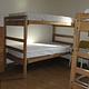 Three sets of twin wooden bunk beds with mattresses in a bedroom