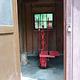 A water pump in a wooden pump house.