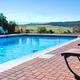 Outdoor pool with mountain views at Royal View RV Park