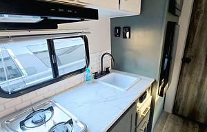 “The Cozy Nook Pet friendly RV Rental”.