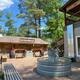 Central plaza/amenity area showing Cozy Hills Mercantile storefront, seating and water trough fountain—clear photo of on-site facilities from the Amenities/home pages.