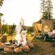 Clear campsite scene showing a tent/RV setup, chairs and a stone fire ring set in a wooded campground environment — good photo for the property gallery. Source page: home page (https://www.rockyvalleyresort.com/).