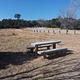 Cedro Peak Campground open field with a picnic table