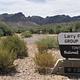 Larry Forbis Group Site sign with desert background