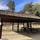 Wooden pavilion with picnic tables